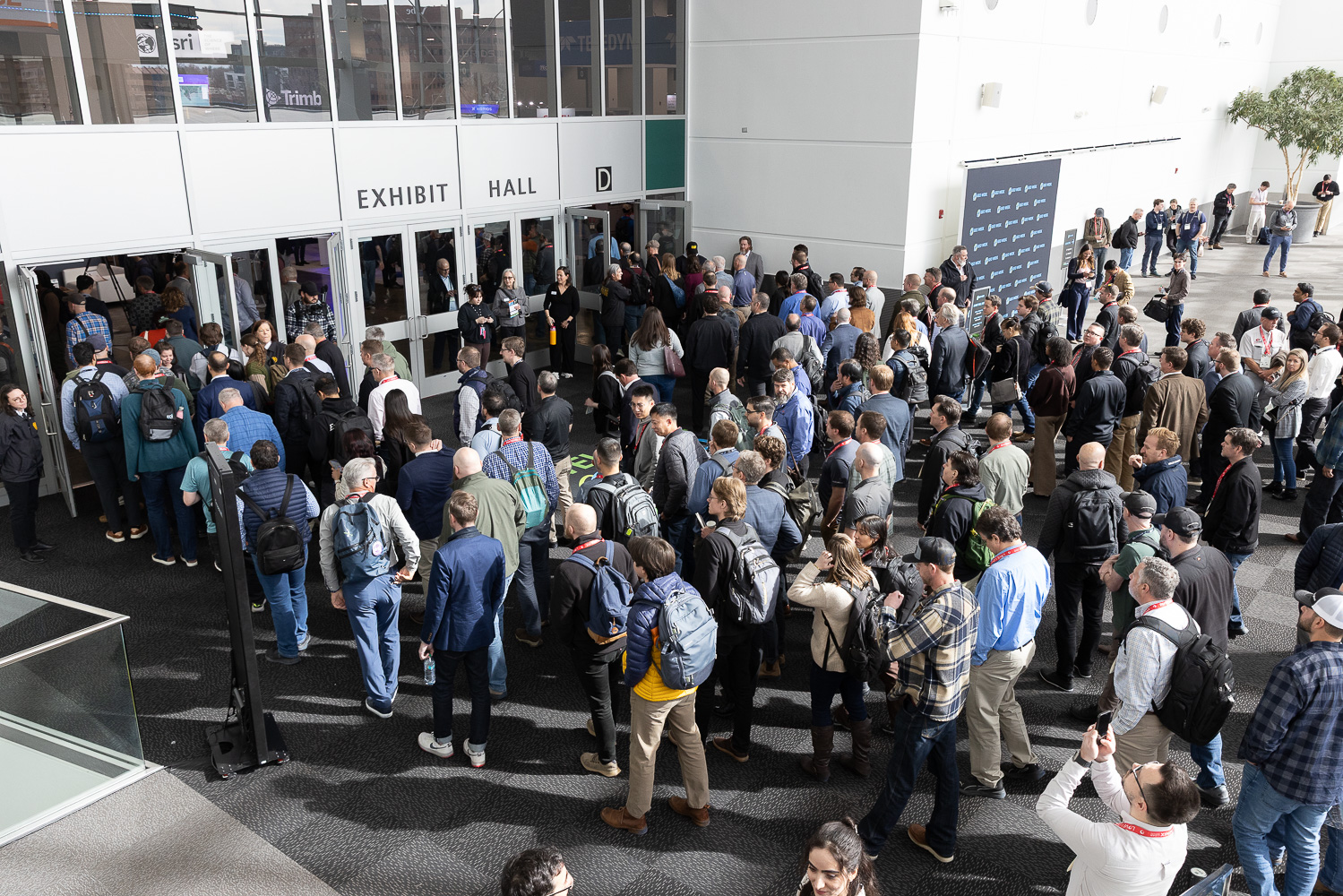 A crowd of people entering geoweek